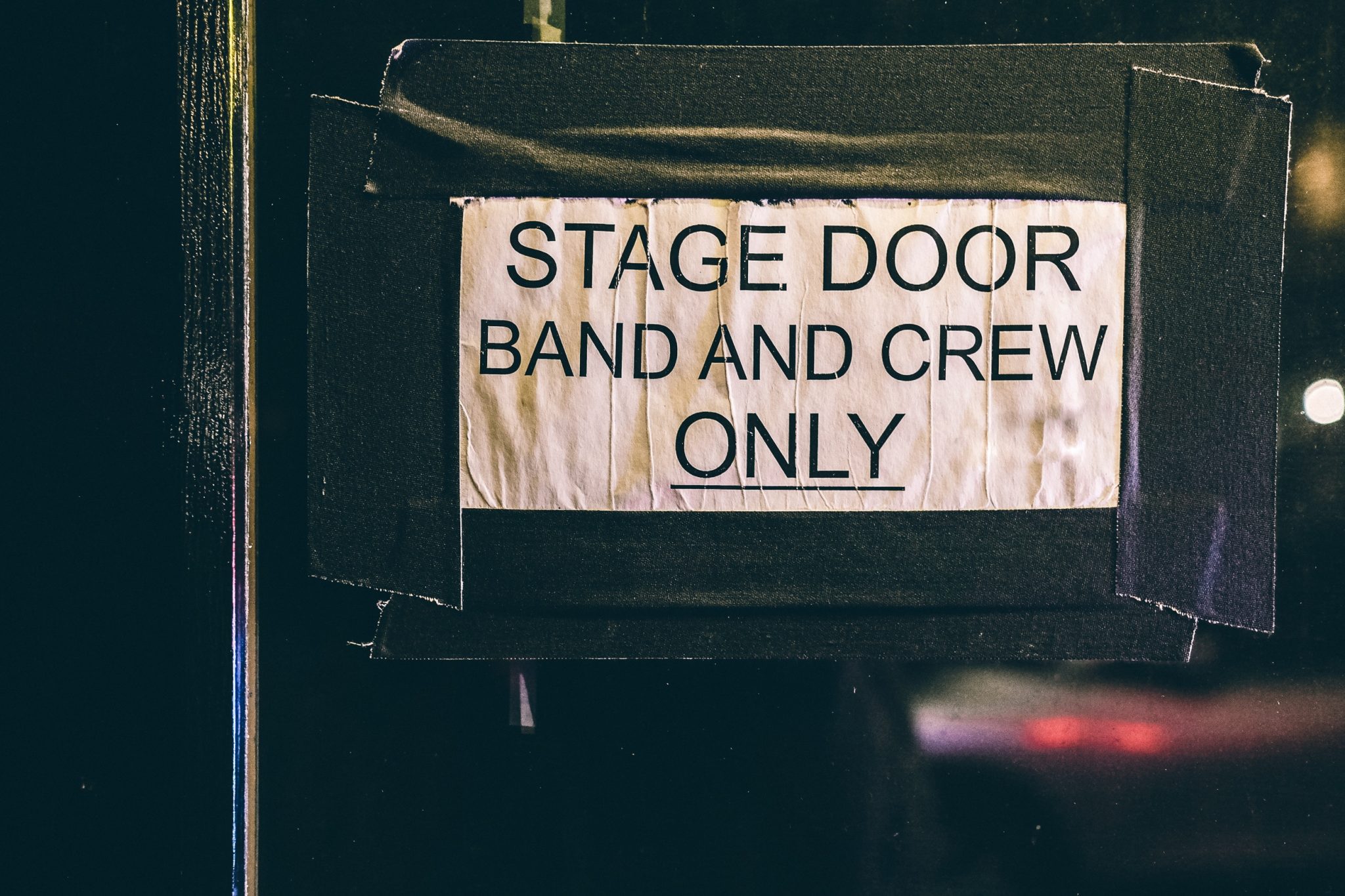 Image of stage door with sign