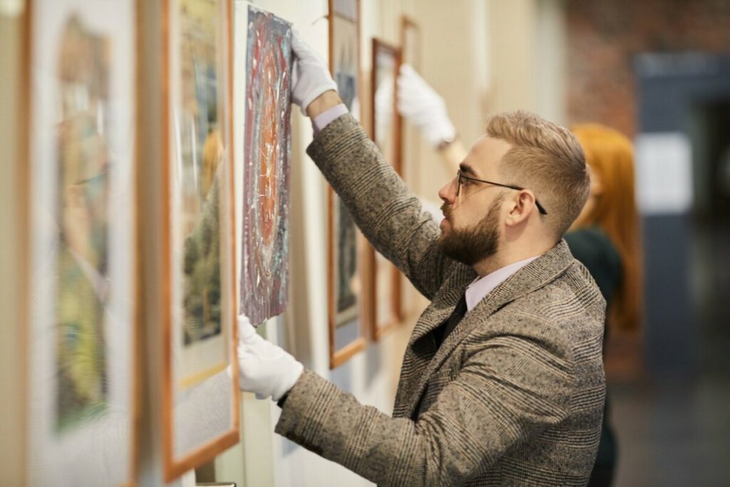 Man preparing for art exhibition